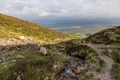 Sheeps, Rock wall, vegetation and stream at Croagh Patrick mountain Royalty Free Stock Photo