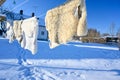 sheepskins hanging on drying rack a cold winterday in Sweden