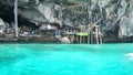 Sheer cliffs, blue water and a Viking cave. Phi Phi Islands, Thailand.