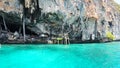 Sheer cliffs, blue water and a Viking cave. Phi Phi Islands, Thailand.