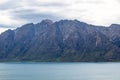 Sheer cliffs by the lake. New Zealand Royalty Free Stock Photo