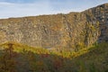 Sheer Cliffs Rise Above the Fall Colors Royalty Free Stock Photo