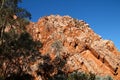 Sheer layered red rock cliffs pointing towards the sky in Australia