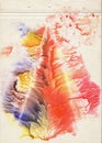 A sheet of brown vintage aged paper stained with blue, red and yellow watercolor paint. Grunge artistic background with multicolor Royalty Free Stock Photo