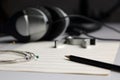 Sheet music, pencil, strings and headphones Royalty Free Stock Photo