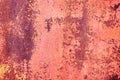 A sheet of old rusty metal painted with red cracked paint. Abstract background. Metallic background. Royalty Free Stock Photo