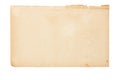 Sheet of old yellowed paper with uneven torn edges on white isolated background Royalty Free Stock Photo