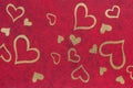 A sheet of ornamental interlining fabric with golden metalized hearts for background Royalty Free Stock Photo