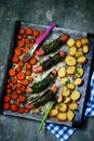 Sheet pan sausages ,carrot and potatoes..style rustic Royalty Free Stock Photo