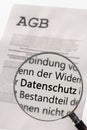 General terms and conditions are examined with the magnifying glass with the German word for data protection