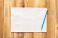 Sheet of paper lying on wooden table Royalty Free Stock Photo