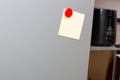 Sheet of paper with magnets on fridge. Space for text Royalty Free Stock Photo