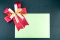 Sheet of paper with a ribbon on a black background Royalty Free Stock Photo