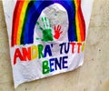 Sheet with rainbow and written in Italian ANDRA `TUTTO BENE, hymn to the resilience of the Italian quarantinates