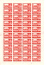 A sheet of vintage five shilling postage stamps from the United kingdom.