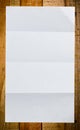 Sheet of white paper on wood Royalty Free Stock Photo