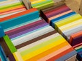 Sheets colored cardboard for designer creative works. Stacks multicolored drawing paper in the store. Colorful art papers on shelf