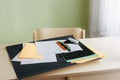 Sheets of colored paper, sketches of a board game, colored pens and scissors on desk Royalty Free Stock Photo