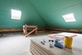 Sheets of drywall, parts of scaffolding, handle tools and construction material in the room of apartment during on the remodeling Royalty Free Stock Photo