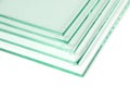 Sheets of Factory manufacturing tempered clear float glass panels cut to size. White background Royalty Free Stock Photo