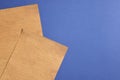 Sheets of old parchment paper on blue background, flat lay. Space for text Royalty Free Stock Photo