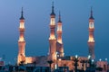 Sheikh`s Zayed`s Mosque glowing colors in Ras al Khaimah, UAE at night echos prayer call along the  Corniche Royalty Free Stock Photo