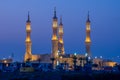 Sheikh`s Zayed`s Mosque glowing colors in Ras al Khaimah, UAE at night echos prayer call along the  Corniche Royalty Free Stock Photo