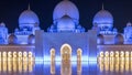 Sheikh Zayed Grand Mosque illuminated at night timelapse, Abu Dhabi, UAE. Royalty Free Stock Photo