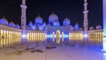 Sheikh Zayed Grand Mosque illuminated at night timelapse hyperlapse, Abu Dhabi, UAE. Royalty Free Stock Photo