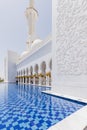 Sheikh Zayed Mosque Left Corridor with Pool, The Great Marble Grand Mosque at Abu Dhabi, UAE Royalty Free Stock Photo