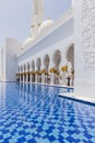 Sheikh Zayed Mosque Left Corridor with Pool, The Great Marble Grand Mosque at Abu Dhabi, UAE Royalty Free Stock Photo