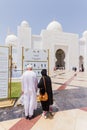 Sheikh Zayed Mosque with Touristsare Reading Information, The Great Marble Grand Mosque at Abu Dhabi, UAE