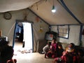 22.05.2017, Sheikhan Camp, Iraq.: Yazidi Family inside a Refugee tent in Northern Iraq close to Mossul fleeing the Islamic State Royalty Free Stock Photo