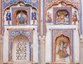 Naive fresco with indian lord Krishna and Garuda on historical house wall of Rajasthan