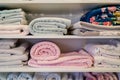 shelf with an array of soft baby blankets