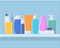 Shelf in the bathroom with cosmetic bottles. Cream, shampoo, gel, spray, tube, soap, toothpaste and toothbrush. Skin and body care