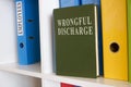 Shelf with book about wrongful discharge.