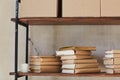 Shelf with boxes and books