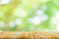 Shelf of Brown wood plank board with blurred green nature background. Old vintage style Royalty Free Stock Photo