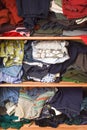 Shelf of clothing to be sorted for charity donation Royalty Free Stock Photo