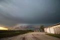 A shelf cloud and storm approach old farm buildings in the Midwest. Royalty Free Stock Photo