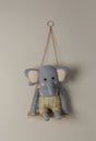 Shelf with cute toy elephant on wall. Child`s room interior element Royalty Free Stock Photo