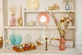 shelf decorated with baskets with Easter eggs, candles, pussy willow, Easter content Royalty Free Stock Photo