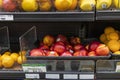 A shelf filled with apricots, nectarines, lemons and other colorful fruits at a market in Atlanta Georgia