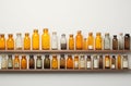 Shelf filled with bottles on wall Royalty Free Stock Photo