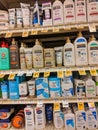 Shelf filled with Gold Bond and other brand named lotions and moisterizers for all skin types inside a Safeway grocery store