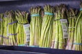 a shelf filled with organic asparagus for $6.99 each at the vegan market in Atlanta Georgia