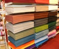 Shelf full of fabrics for sale at the fair of decoration Royalty Free Stock Photo