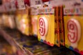 Shelf with number 9 birthday candle on supermarket or shopping center background.