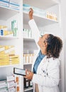 Shelf, pharmacy product and woman with tablet or medicine management, stock research or medical inventory. Digital Royalty Free Stock Photo